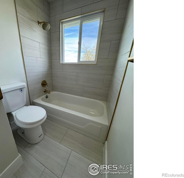 2221 E 84th Ave, Denver, CO 80229 - bathroom with toilet, tile patterned floors, and shower / bath combination