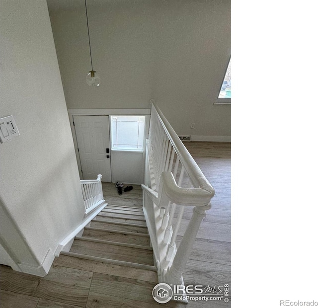 2221 E 84th Ave, Denver, CO 80229 - stairway featuring baseboards and wood finished floors