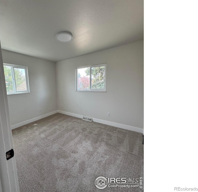 2221 E 84th Ave, Denver, CO 80229 - unfurnished room with baseboards and carpet floors