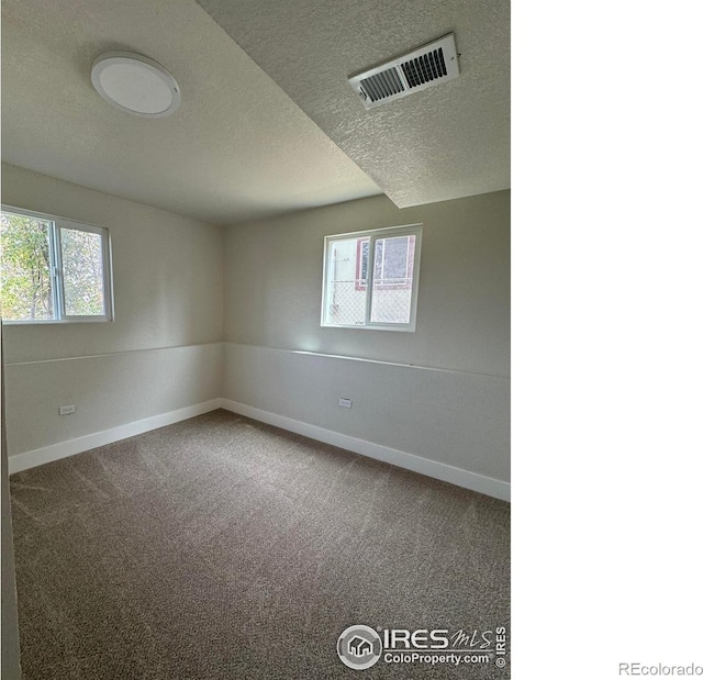 2221 E 84th Ave, Denver, CO 80229 - carpeted empty room with baseboards and a textured ceiling