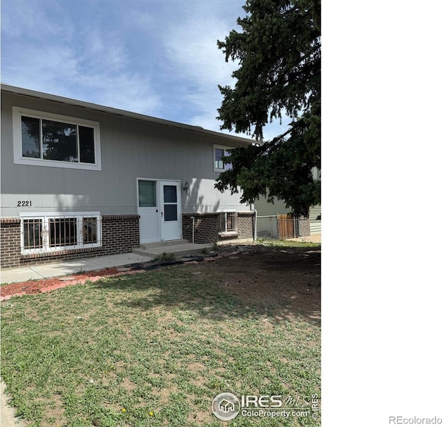 2221 E 84th Ave, Denver, CO 80229 - rear view of property with brick siding