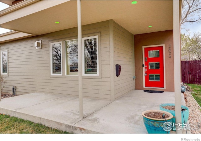 2624 S Race St, Denver, CO 80210 - view of exterior entry featuring a patio and fence