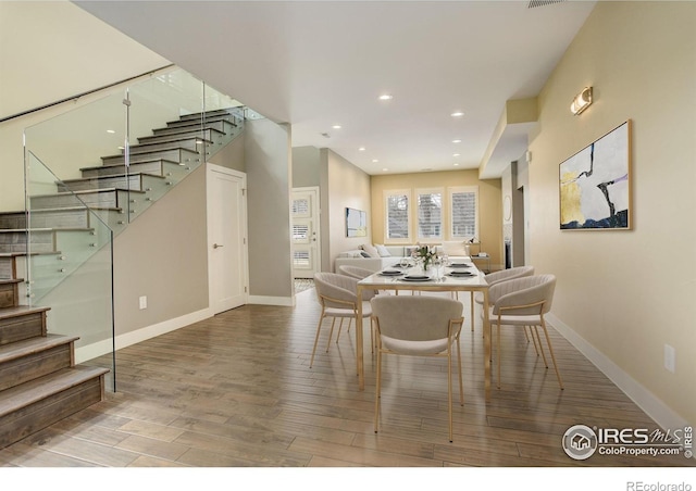 2624 S Race St, Denver, CO 80210 - dining space featuring stairway, wood finished floors, baseboards, and recessed lighting