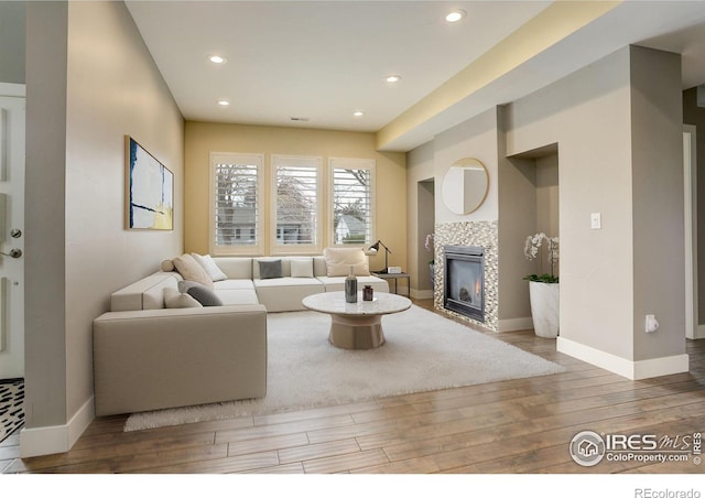 2624 S Race St, Denver, CO 80210 - living room with wood finished floors, a fireplace, baseboards, and recessed lighting