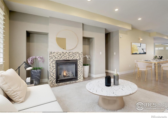2624 S Race St, Denver, CO 80210 - living area with recessed lighting, a fireplace, wood finished floors, and baseboards