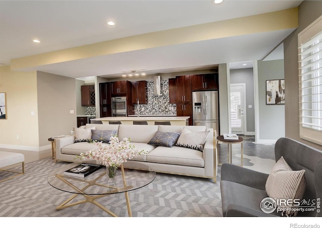 2624 S Race St, Denver, CO 80210 - living room featuring recessed lighting, healthy amount of natural light, and baseboards