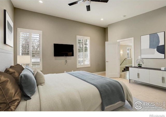2624 S Race St, Denver, CO 80210 - bedroom with light colored carpet, multiple windows, recessed lighting, connected bathroom, and ceiling fan