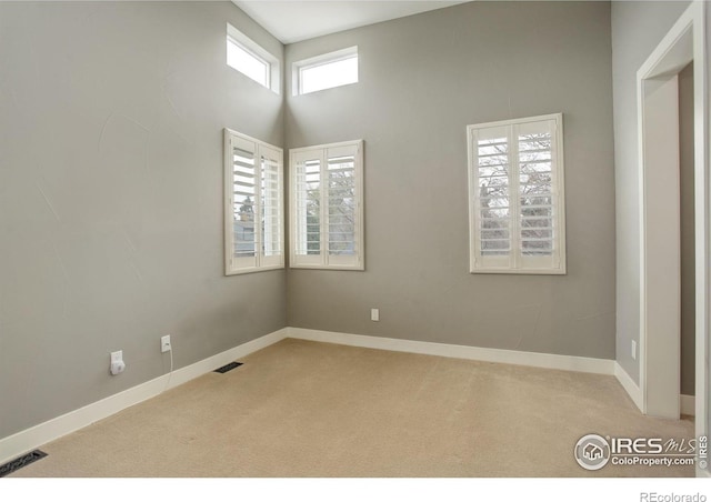 2624 S Race St, Denver, CO 80210 - carpeted empty room with baseboards