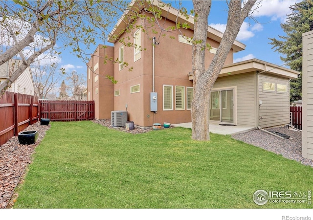 2624 S Race St, Denver, CO 80210 - rear view of house featuring central AC unit, a patio, and stucco siding