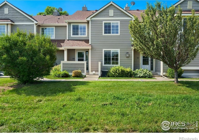 2120 Timber Creek Dr Unit H4, Fort Collins, CO 80528 - view of front facade featuring a shingled roof and a front lawn