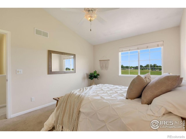 bedroom with visible vents, lofted ceiling, baseboards, ceiling fan, and carpet