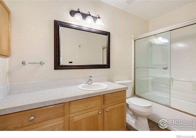 2120 Timber Creek Dr Unit H4, Fort Collins, CO 80528 - full bathroom featuring vanity, enclosed tub / shower combo, tile patterned floors, and toilet