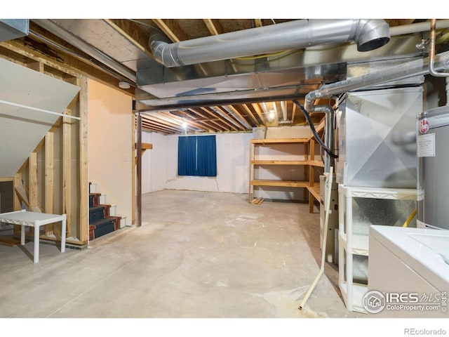 unfinished basement with stairs and water heater