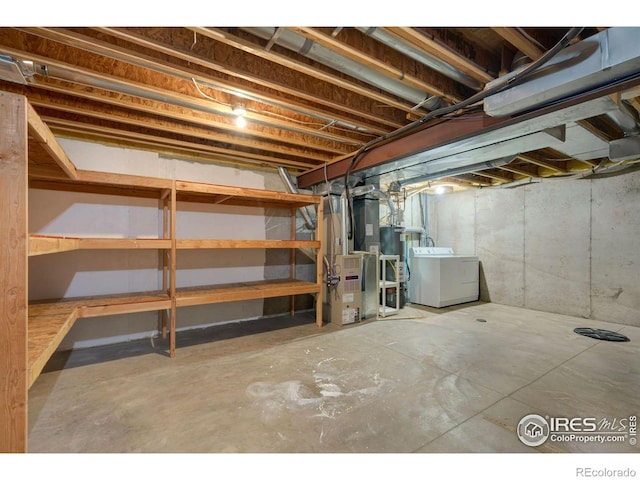 unfinished basement featuring heating unit and gas water heater