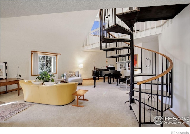 6611 Lakeview Dr, Boulder, CO 80303 - living area with stairway, carpet floors, baseboards, and a high ceiling