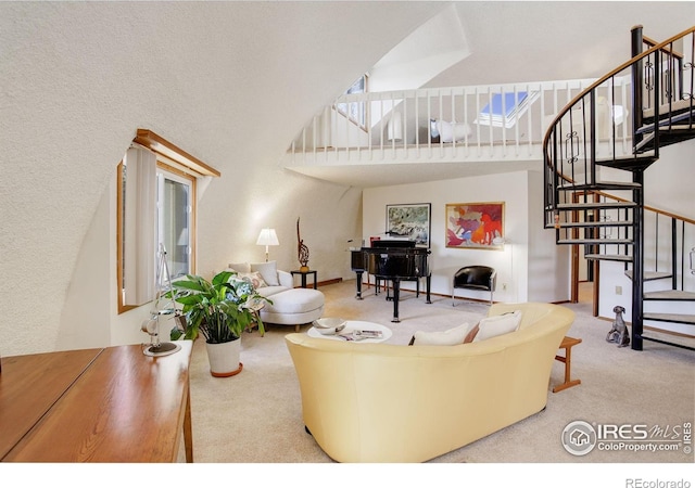 6611 Lakeview Dr, Boulder, CO 80303 - carpeted living area featuring a towering ceiling and stairway