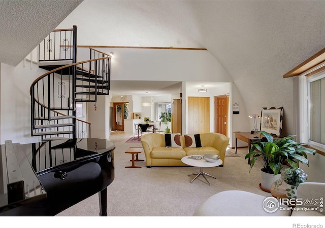 6611 Lakeview Dr, Boulder, CO 80303 - carpeted living room featuring plenty of natural light, a textured ceiling, stairs, and lofted ceiling