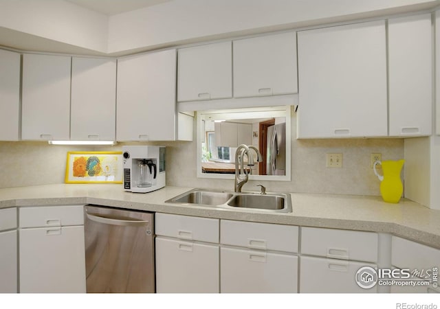 6611 Lakeview Dr, Boulder, CO 80303 - kitchen with a sink, light countertops, white cabinetry, and dishwasher