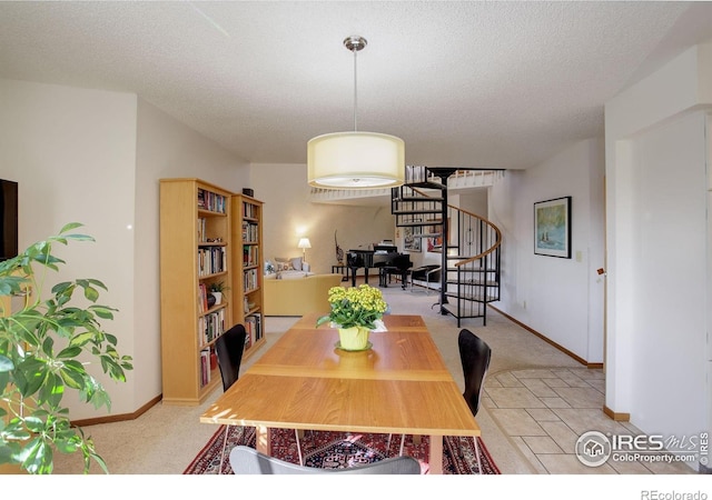 6611 Lakeview Dr, Boulder, CO 80303 - dining room featuring baseboards, a textured ceiling, stairs, and light carpet