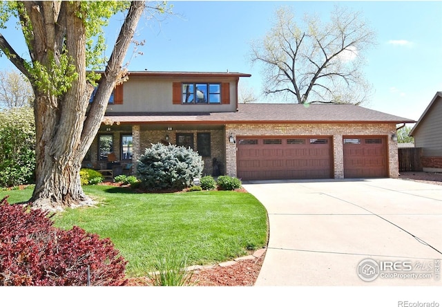 1021 Pinyon Dr, Windsor, CO 80550 - traditional home with an attached garage, brick siding, driveway, and a front yard