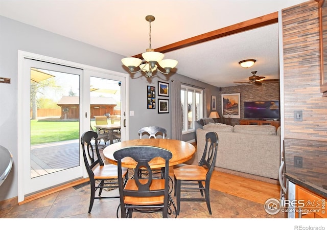 1021 Pinyon Dr, Windsor, CO 80550 - dining space featuring ceiling fan with notable chandelier