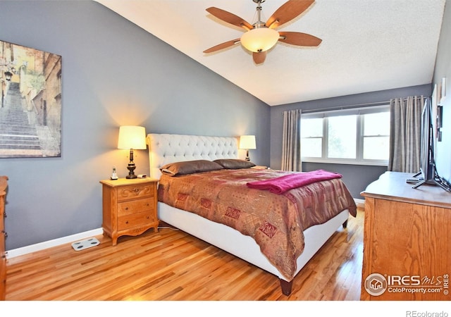 1021 Pinyon Dr, Windsor, CO 80550 - bedroom with baseboards, light wood finished floors, ceiling fan, and lofted ceiling