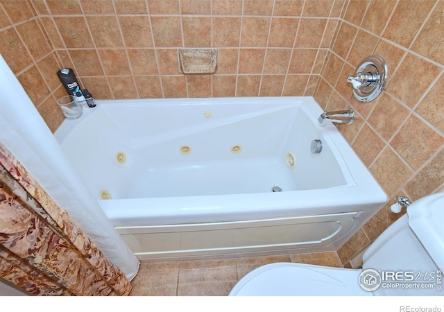 1021 Pinyon Dr, Windsor, CO 80550 - bathroom featuring a whirlpool tub and tile patterned flooring