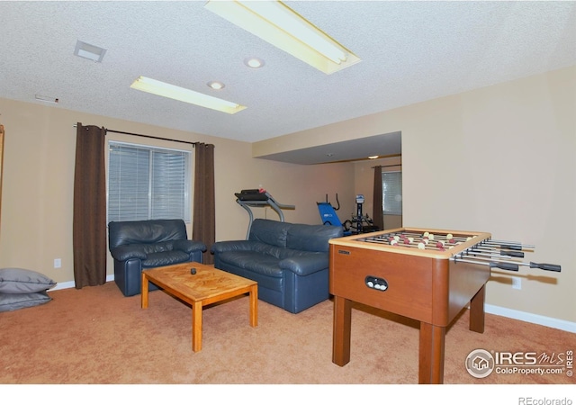 1021 Pinyon Dr, Windsor, CO 80550 - playroom with baseboards, light carpet, and a textured ceiling