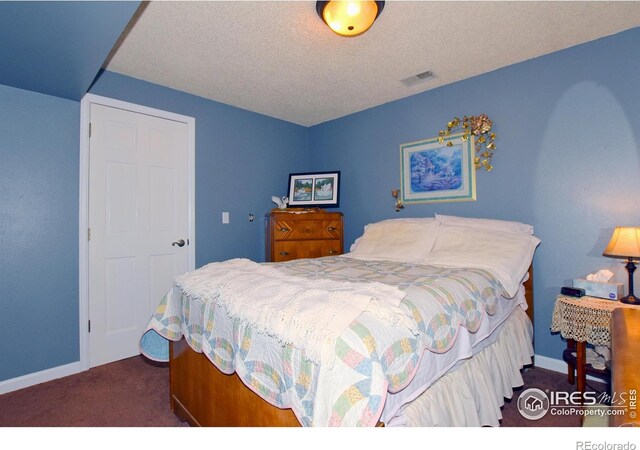 1021 Pinyon Dr, Windsor, CO 80550 - carpeted bedroom with a textured ceiling, baseboards, and visible vents