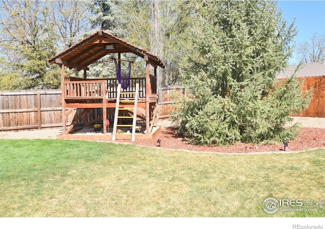 1021 Pinyon Dr, Windsor, CO 80550 - view of yard with a fenced backyard and a wooden deck