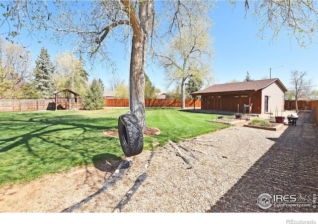 1021 Pinyon Dr, Windsor, CO 80550 - view of yard with a playground and a fenced backyard