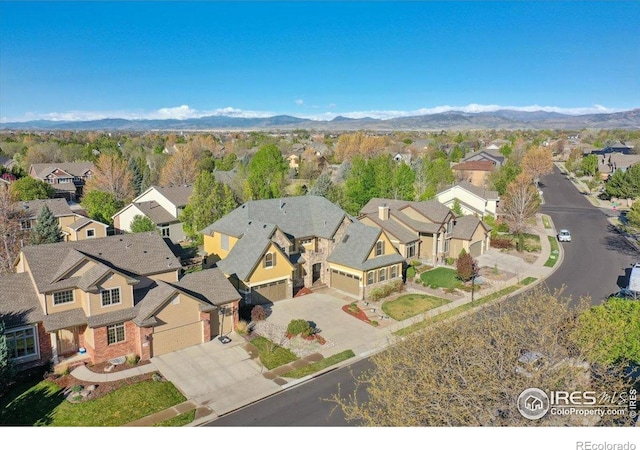 drone / aerial view with a residential view and a mountain view