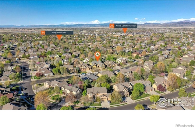 birds eye view of property featuring a residential view and a mountain view