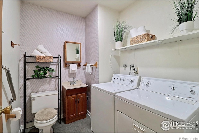 821 36th Ave, Greeley, CO 80634 - clothes washing area with washer and dryer and dark colored carpet