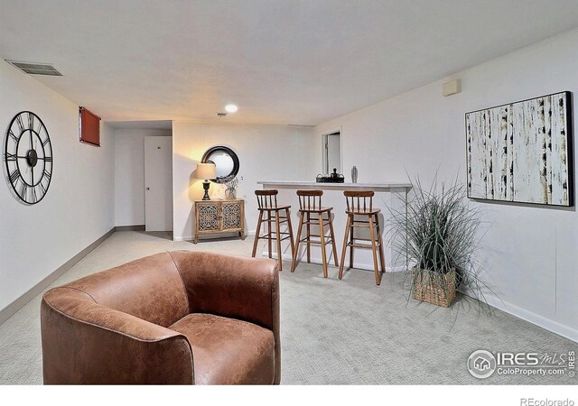 821 36th Ave, Greeley, CO 80634 - living room featuring carpet and baseboards