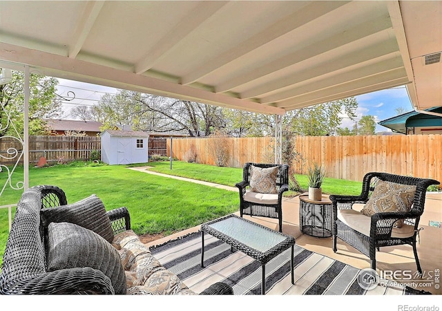 821 36th Ave, Greeley, CO 80634 - view of patio with a storage shed, an outdoor structure, and an outdoor living space