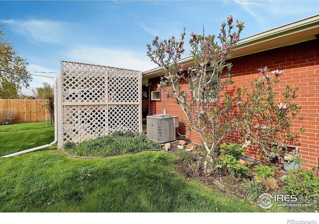 821 36th Ave, Greeley, CO 80634 - view of side of property with central AC and brick siding