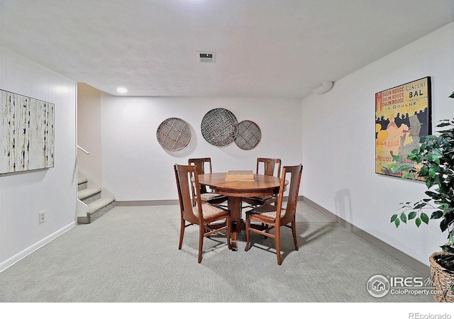 821 36th Ave, Greeley, CO 80634 - carpeted dining space with stairs and baseboards