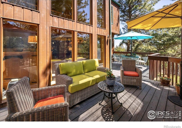 187 Rocky Knob Ln, Nederland, CO 80466 - wooden terrace with outdoor dining area and an outdoor hangout area