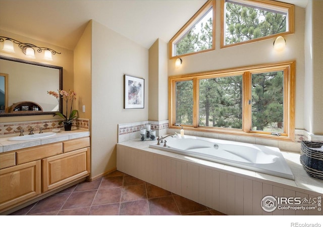 187 Rocky Knob Ln, Nederland, CO 80466 - full bath with vanity, tile patterned flooring, a garden tub, and lofted ceiling