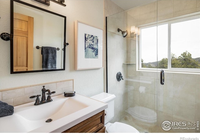 187 Rocky Knob Ln, Nederland, CO 80466 - bathroom with toilet, a shower stall, and vanity