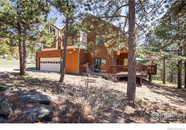 187 Rocky Knob Ln, Nederland, CO 80466 - chalet / cabin with a garage and a deck