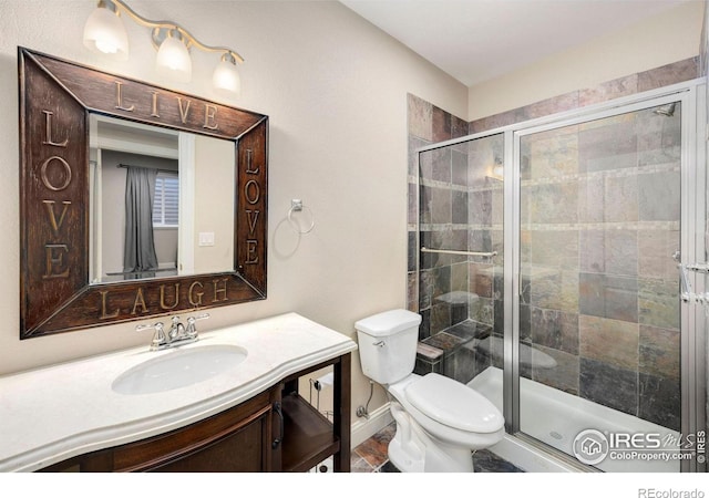 1105 Shelby Dr, Berthoud, CO 80513 - bathroom featuring vanity, toilet, a shower stall, and baseboards