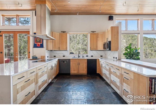 1127 Valley Ln, Boulder, CO 80302 - kitchen with dishwashing machine, a peninsula, island exhaust hood, and stone tile flooring