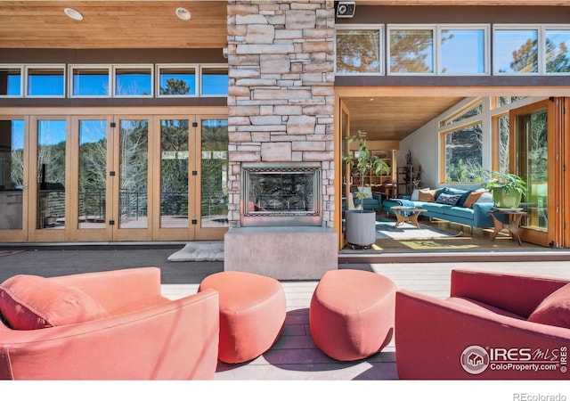 1127 Valley Ln, Boulder, CO 80302 - living area featuring wood ceiling and a fireplace