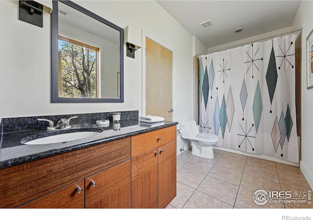 1127 Valley Ln, Boulder, CO 80302 - bathroom with tile patterned flooring, toilet, and vanity