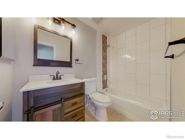 full bathroom featuring vanity, bathing tub / shower combination, and toilet