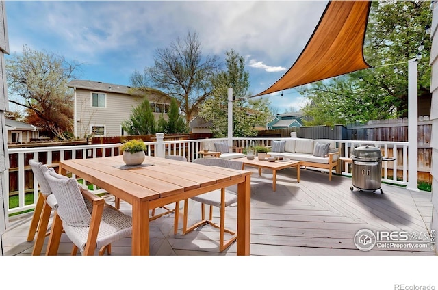 2330 Redwood Ave, Lafayette, CO 80026 - wooden terrace with a fenced backyard, outdoor dining space, and an outdoor living space