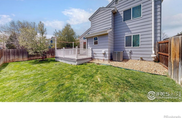 2330 Redwood Ave, Lafayette, CO 80026 - rear view of property featuring a fenced backyard, central air condition unit, a yard, and a deck