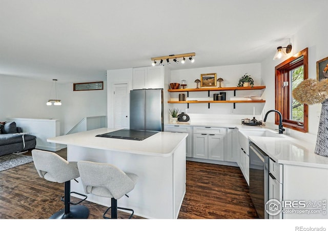 4731 Jay Rd, Boulder, CO 80301 - kitchen with freestanding refrigerator, a sink, open shelves, a breakfast bar, and dark wood finished floors